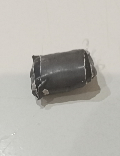 MEF Chris 0.7 g bookmark on the scales.png